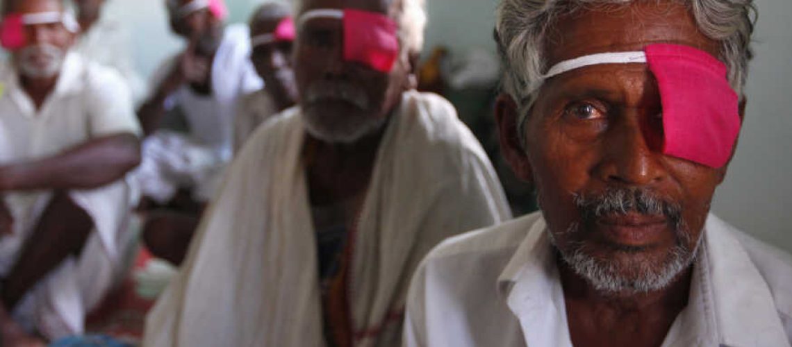 Patients sit after their cataract surgeries at a hospital of the Aravind Eye Care System in Madurai, India.